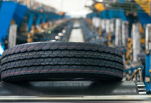 Tire being checked on quality uniformity by machine